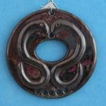 Serpent pendant with holes
